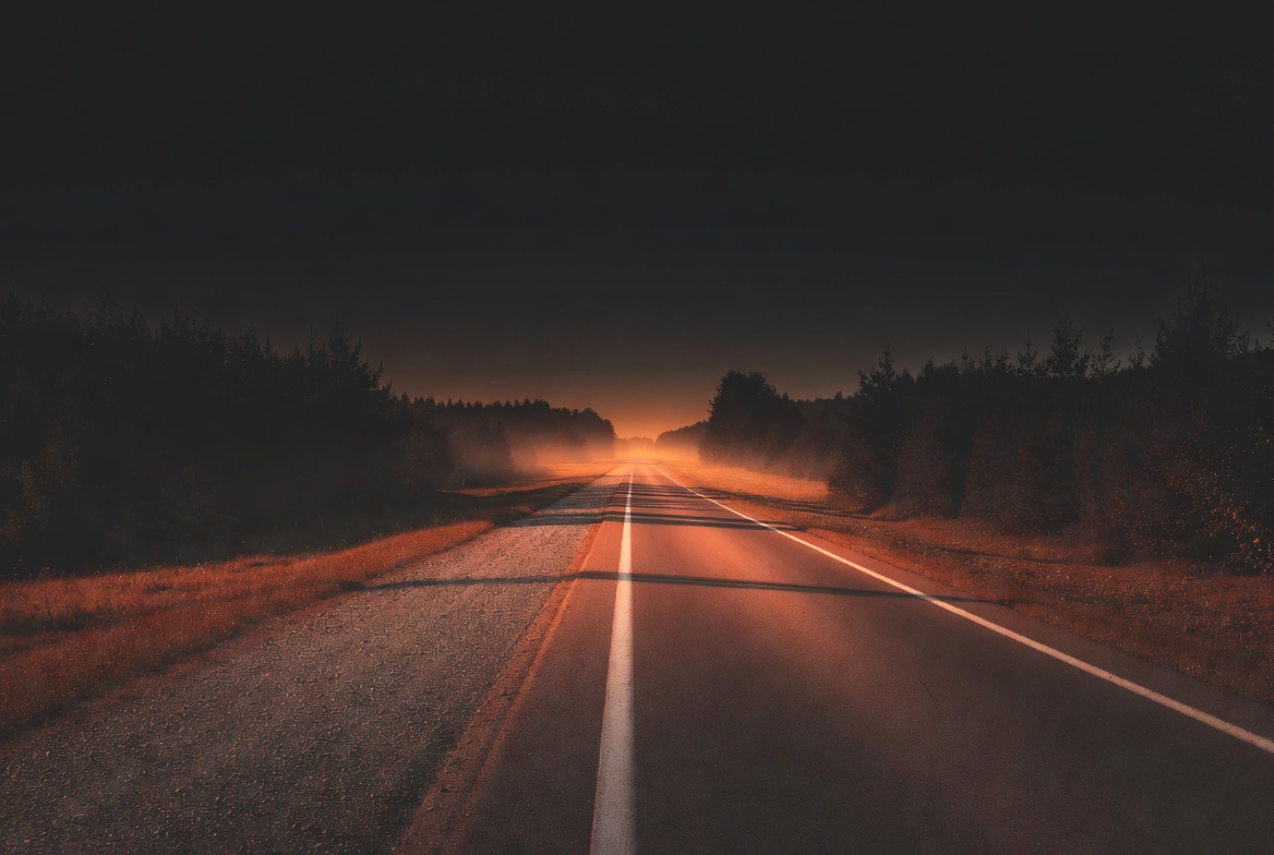 Empty road stretching to horizon - freedom of running
